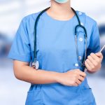 Nurse holding digital tablet in hospital