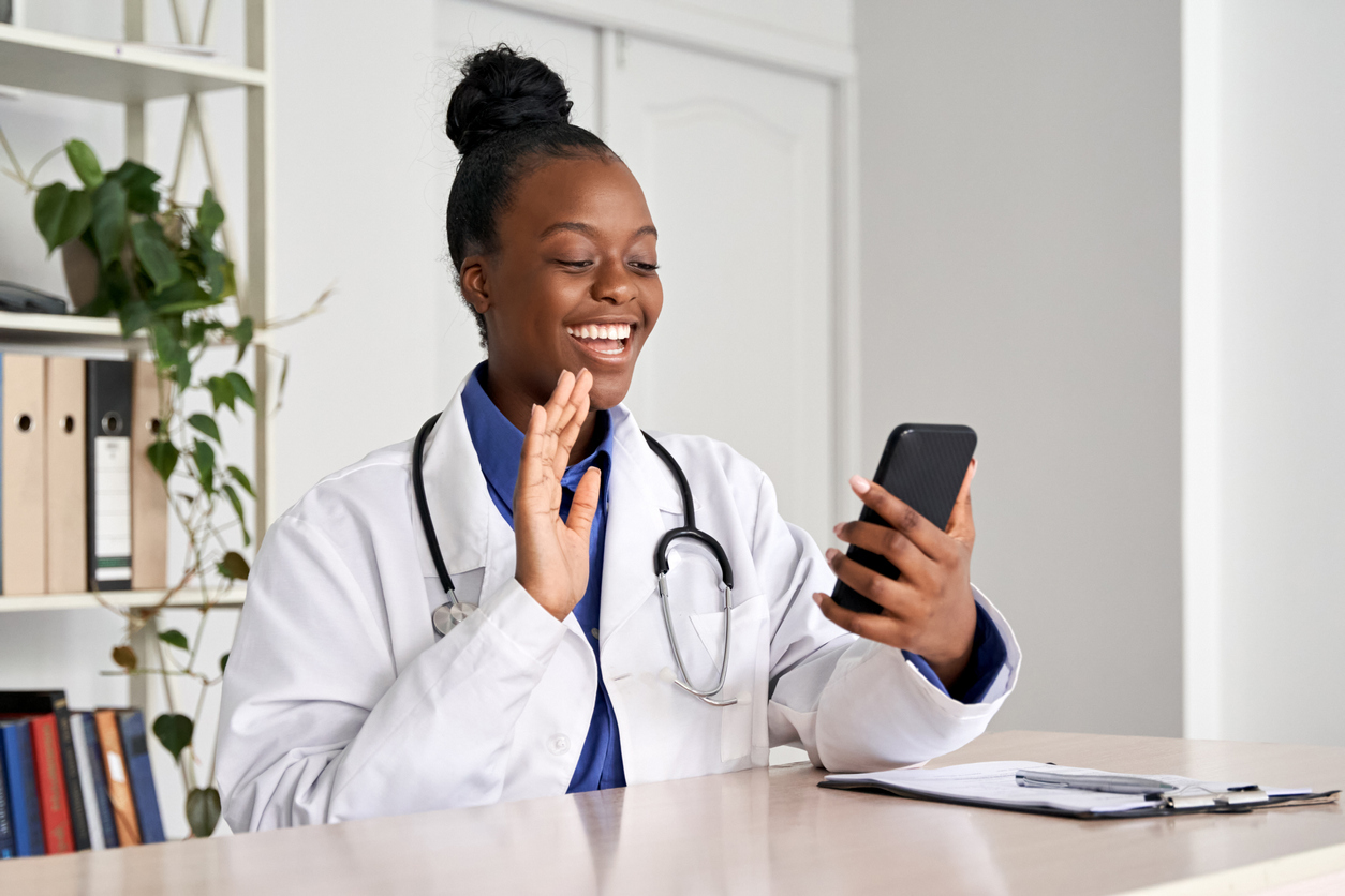 doctor holding phone talk to patient