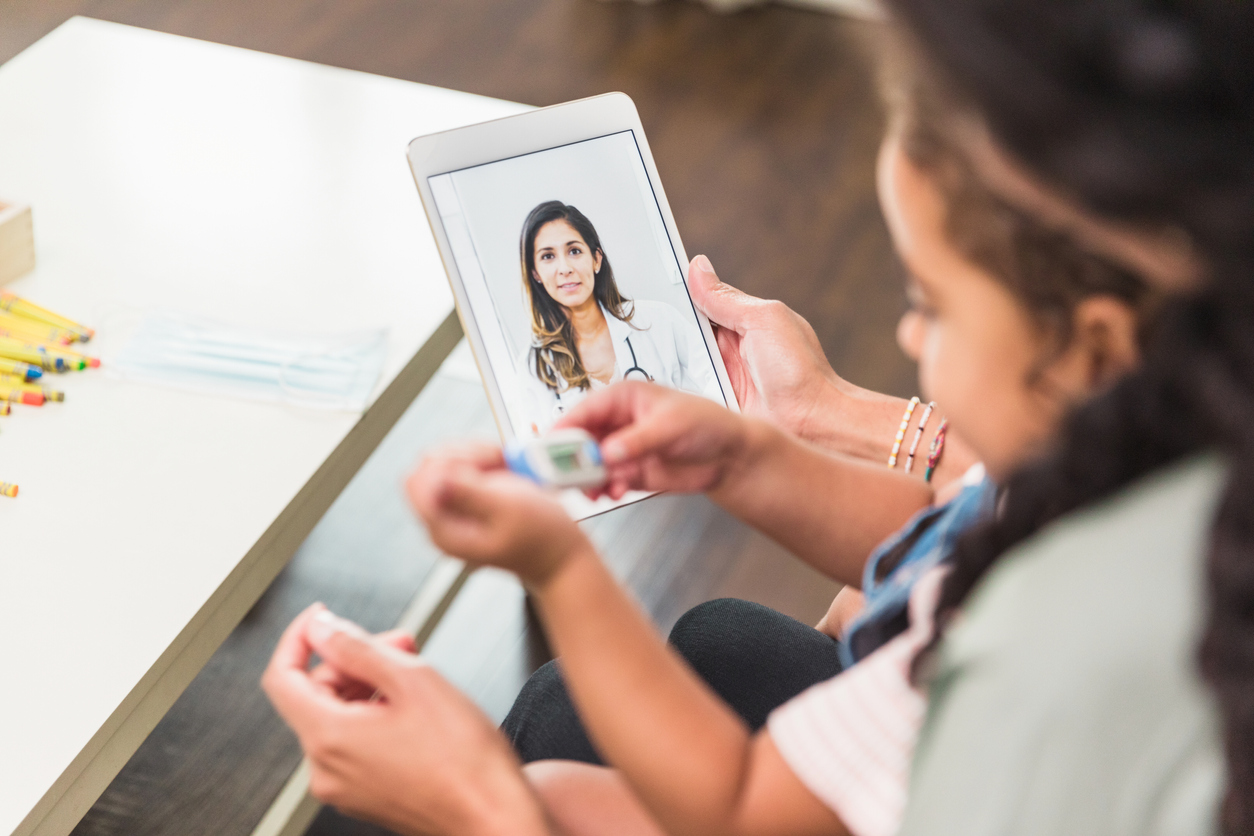 Pediatrician talks with patient's mother