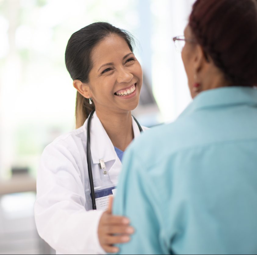 An Elderly Woman in Her Doctors Office Receiving a Check-Up stock photo