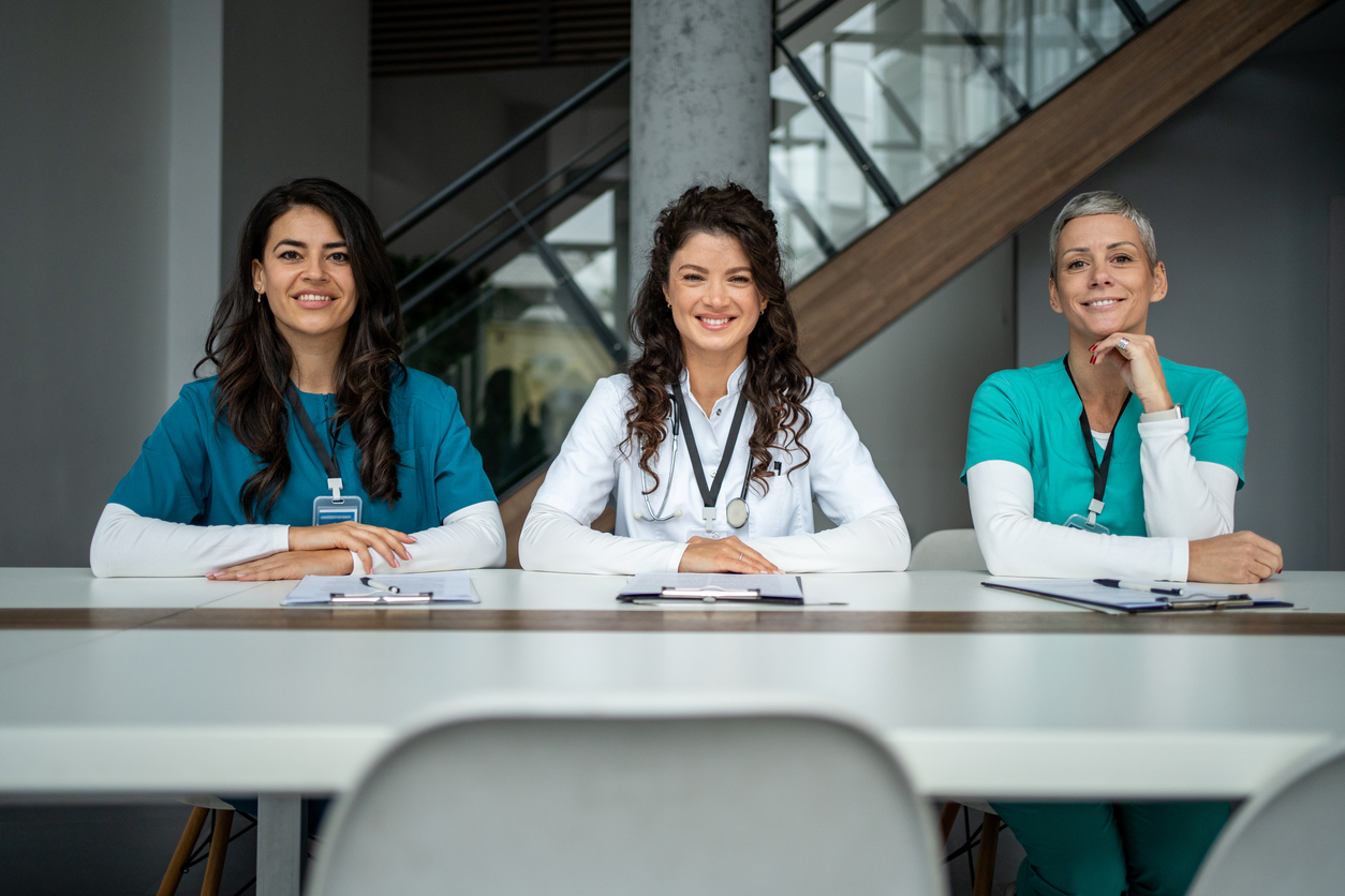 Women doctors at table